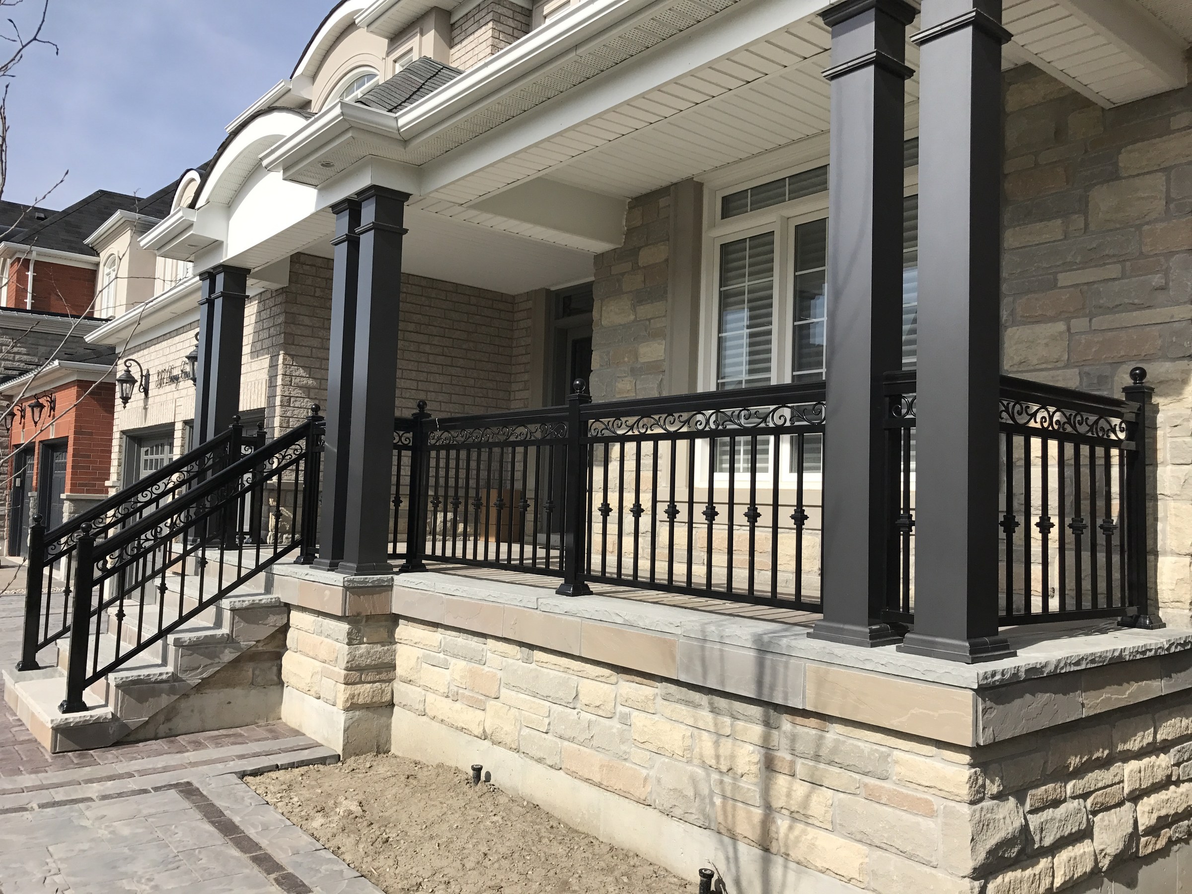 Fiberglass square columns at a porch entry