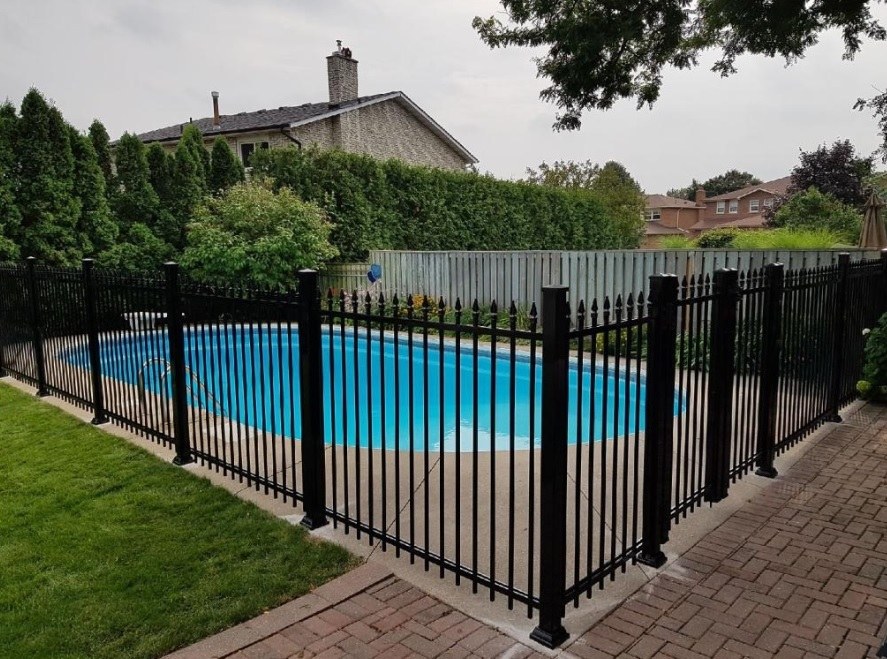 Wood fence with steel posts in a residential backyard