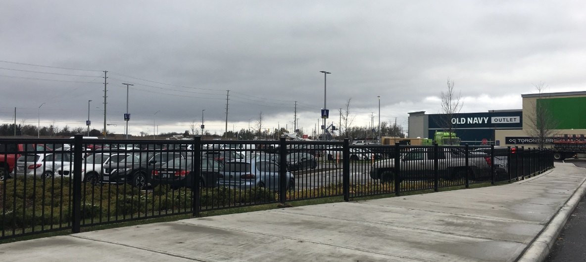 Aluminum fence at Toronto Premium Outlet mall — commercial install