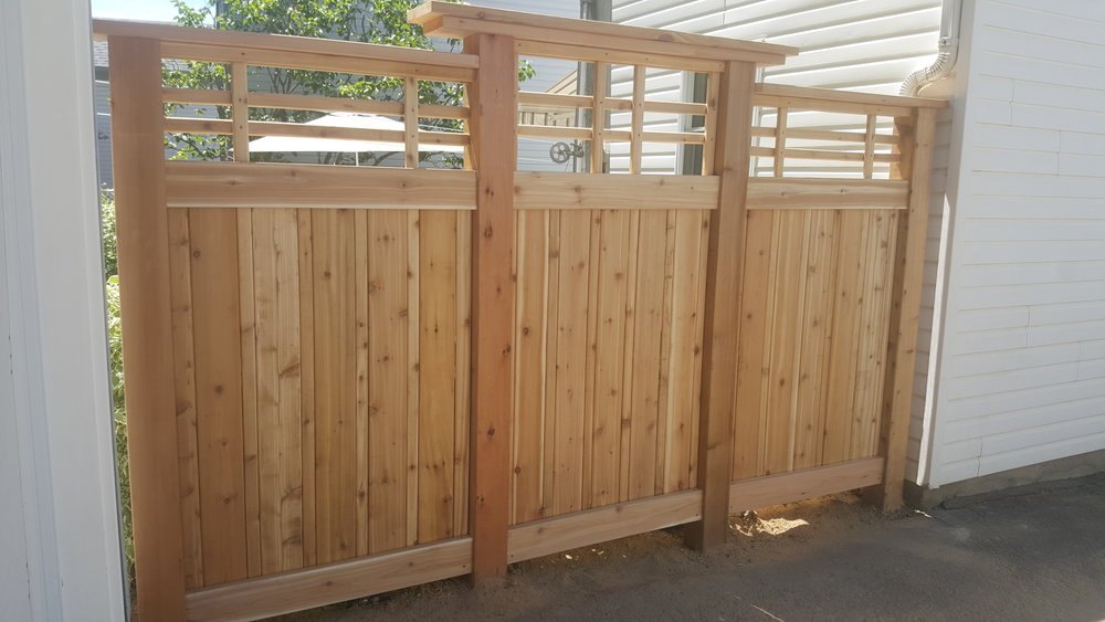 Custom cedar fence section with pergola-style top